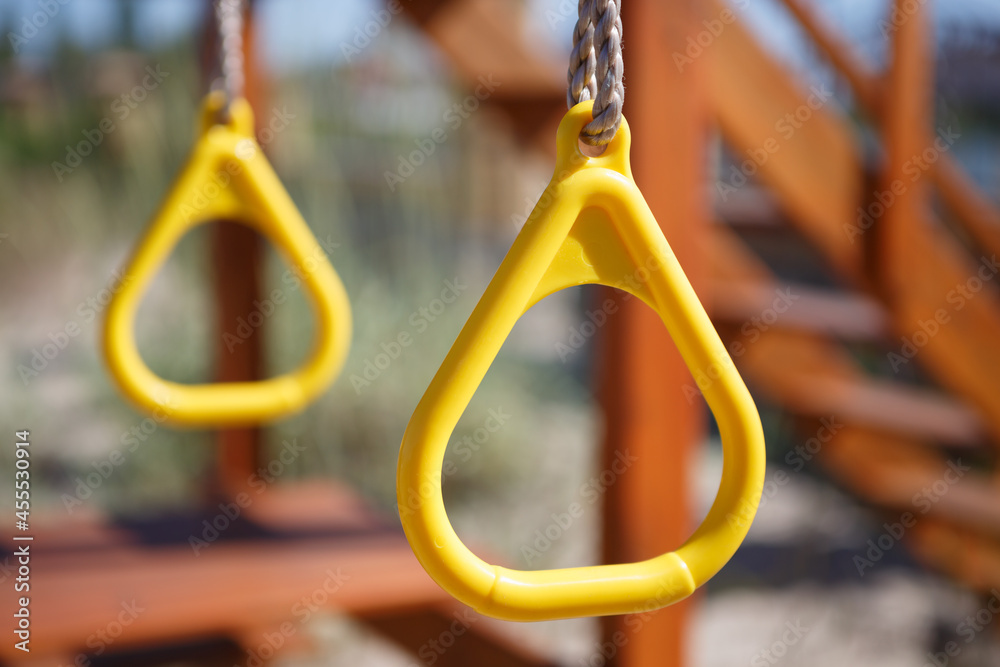 Plastic swing rings on outdoor playground for children