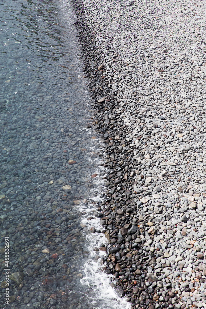 Water edge on the cobble beach Water edge on the cobble beach