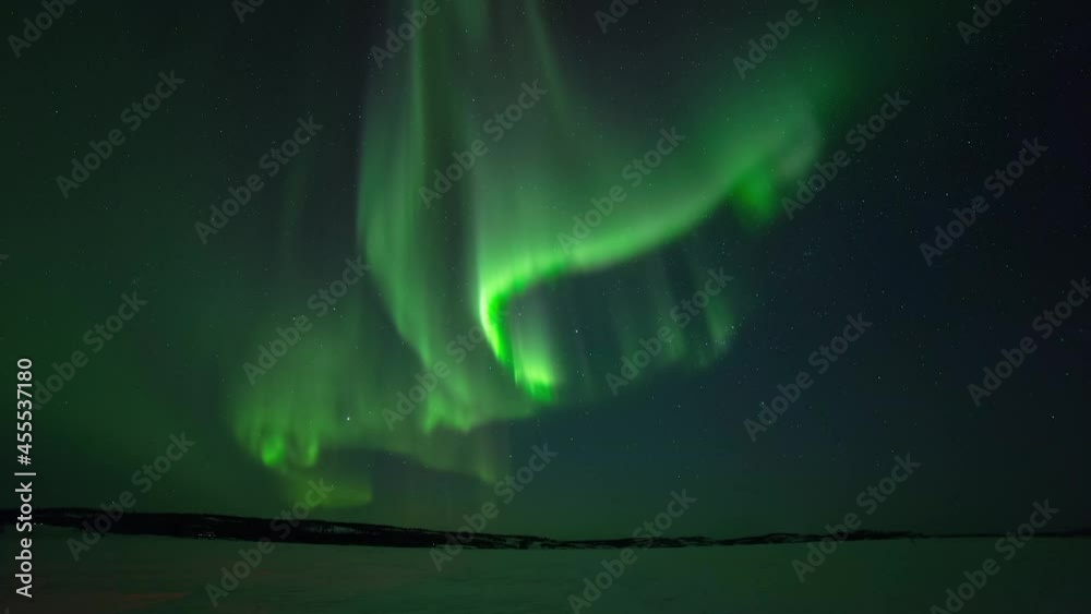 Time Lapse Lockdown Shot Of Snow Covered Landscape Below Aurora Borealis During Night - British Columbia, Canada Time Lapse Lockdown Shot Of Snow Covered Landscape Below Aurora Borealis During Night - British Columbia, Canada