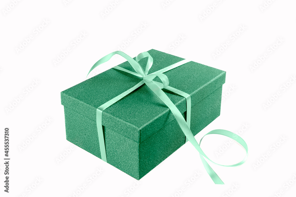 Gifts on a white background. Green box are tied with a green ribbon. Concept. Isolate. Photo Gifts on a white background. Green box are tied with a green ribbon. Concept. Isolate. Photo