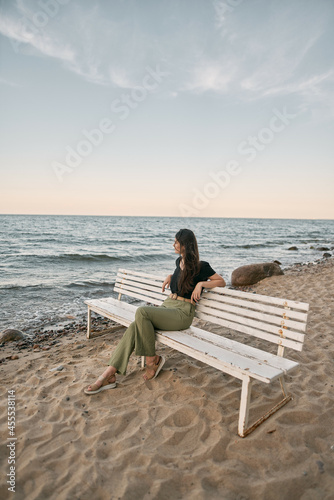 Lonely woman on the beach. COncept photo of depressed emotion and loneliness © AlexGo