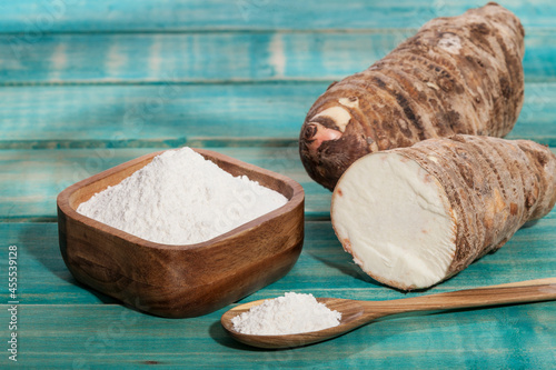 Photos Taro Root of Colocasia esculenta and Organic Taro Flour in a bowl