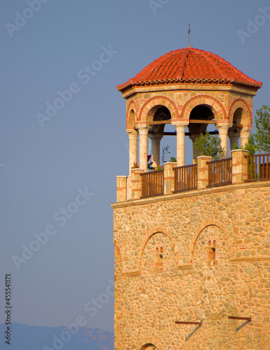 Monastery tower in the mountains during sunset