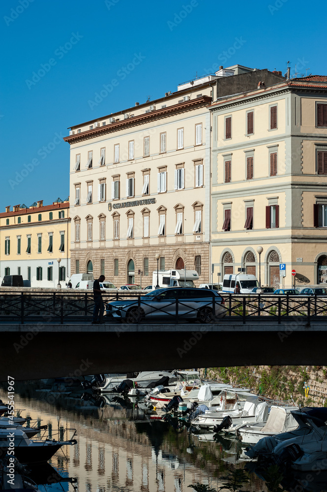 Livorno: Bridge over the Fosso Reale, at the Scali Olandesi. Boats moored along the canal.