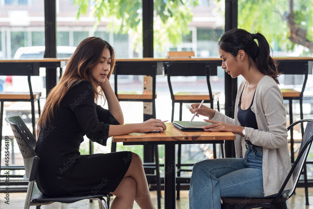Team of young Asian businesswoman sitting at work meeting learning to work together brainstorm at the office.