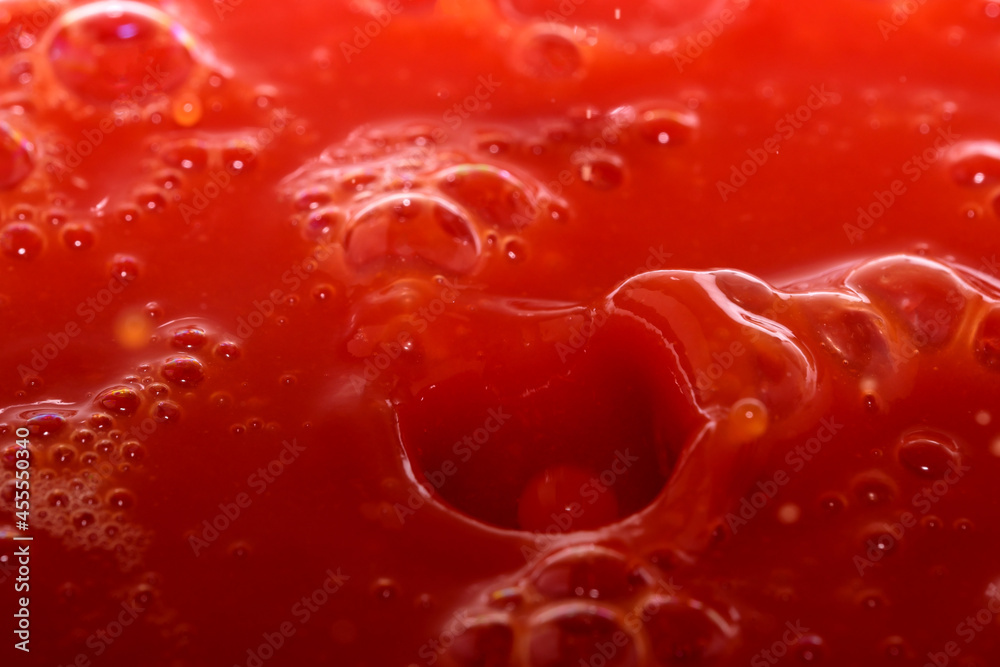 Red grocery background of tomato juice Red grocery background of tomato juice