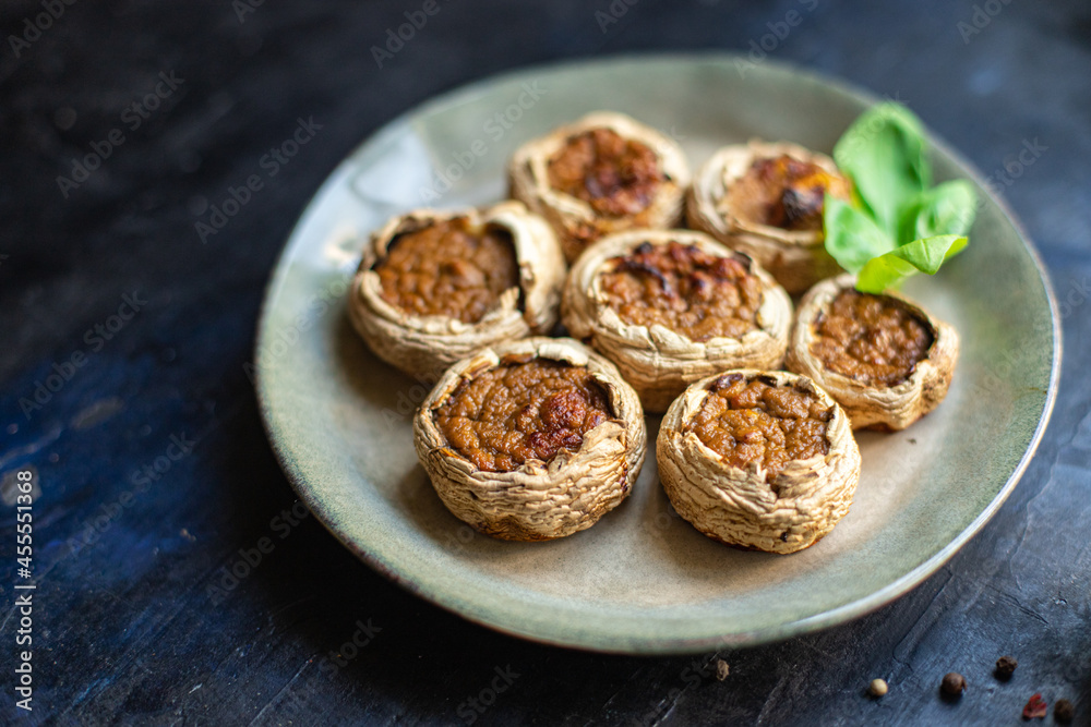 mushroom stuffed vegetables mushrooms baked no meat fresh portion ready to eat meal snack on the table copy space food background rustic. top view keto or paleo diet veggie vegan or vegetarian mushroom stuffed vegetables mushrooms baked no meat fresh portion ready to eat meal snack on the table copy space food background rustic. top view keto or paleo diet veggie vegan or vegetarian