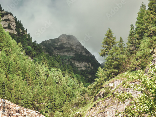 Scenic landscape in Bucegi Mountains from Jepii Mici trail, a popular hiking path Carpathian Mountains, Romania. photo