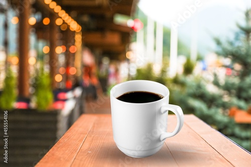 Fresh hot coffee in white cup on a desk