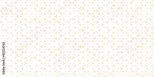 Golden vector seamless pattern with small linear triangles. Subtle minimalist background with scattered tiny shapes. Luxury modern gold and white ornament texture. Trendy modern minimal repeat design