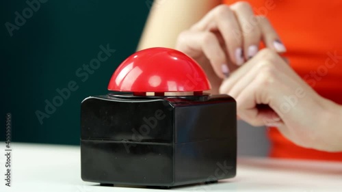 The woman presses the red button. Stop. photo
