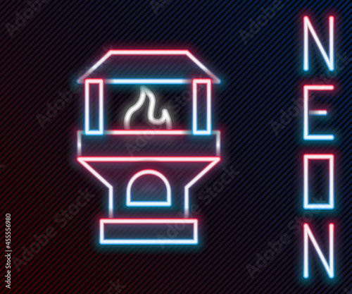 Glowing neon line Brick stove icon isolated on black background. Brick fireplace, masonry stove, stone oven icon.Colorful outline concept. Vector