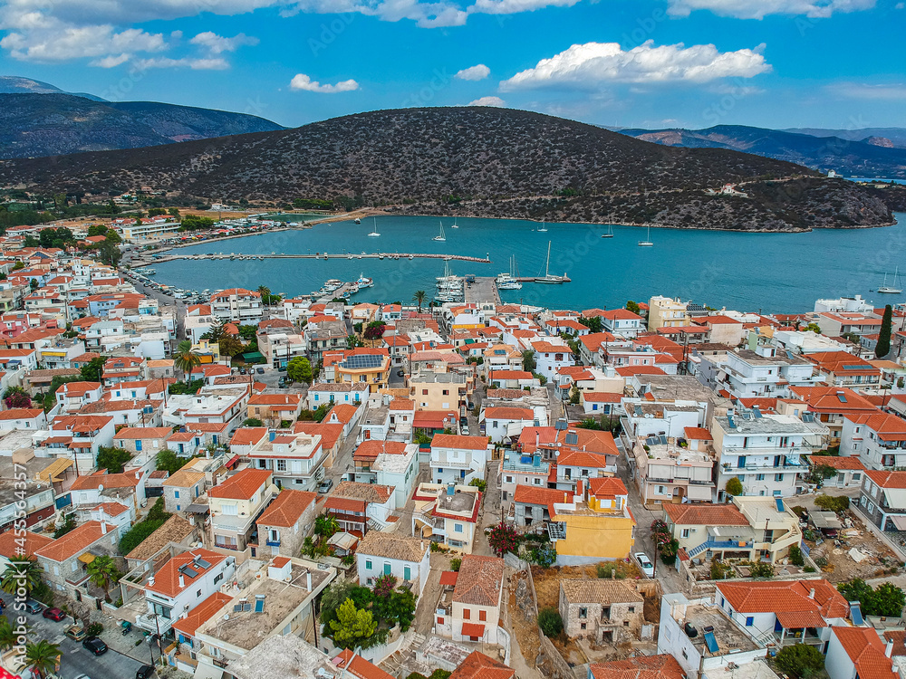 Aerial panoramic photo of picturesque seaside town of Ermioni built in peninsula with forest of Bistis at the end, Argolida, Peloponnese, Greece