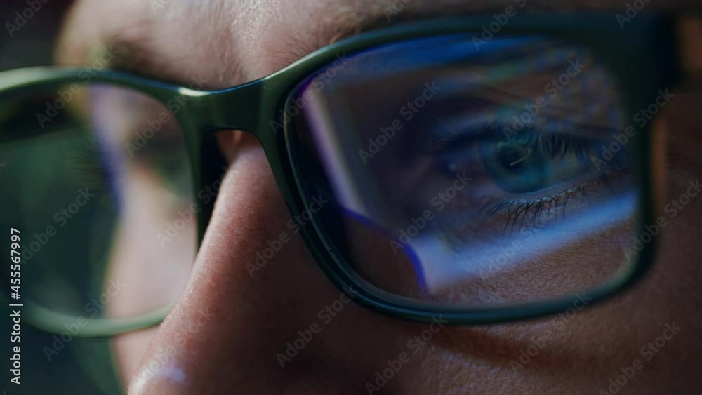 Super Close-up Portrait of Software Engineer Working on Computer, App Reflecting in Glasses. Digital Developer Working on Innovative e-Commerce Application with Machine Learning, AI, Big Data