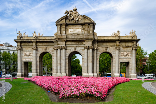 MADRID, SPAIN - SEPTEMBER 7, 2021. Puerta de Alcalá, located in the center of the roundabout of the Plaza de la Independencia, next to the Retiro Park. World Heritage architecture, in Spain. Europe.