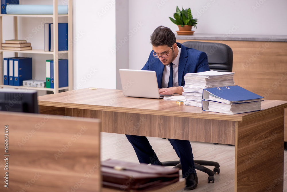 Young businessman employee working in the office Young businessman employee working in the office