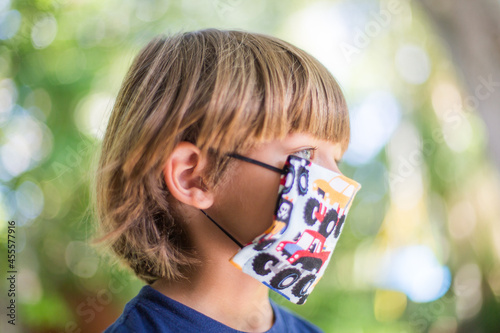 boy with facemask outdoor photo