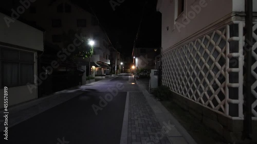 Night walking on street in Japan. POV gimbal shot