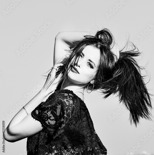 grayscale photo of woman in dark lace dress photo