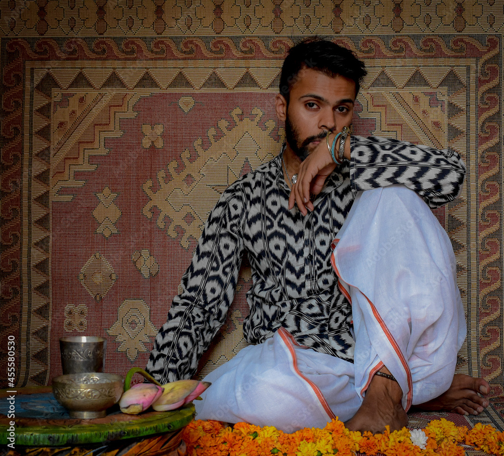 Indian man sitting on floor indoor Stock Photo | Adobe Stock