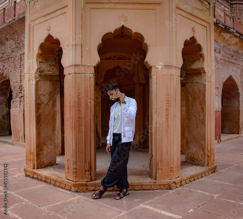 Man standing in the outdoor of Safdarjung Tomb photo