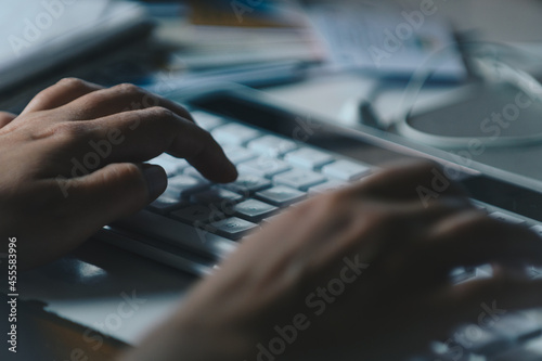 Person using computer keyboard photo