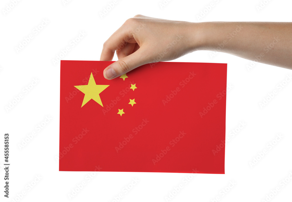 Female hand with paper Chinese flag on white background
