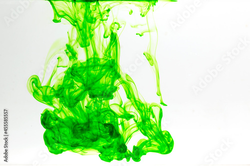 Slow motion of green liquid in clear liquid photo
