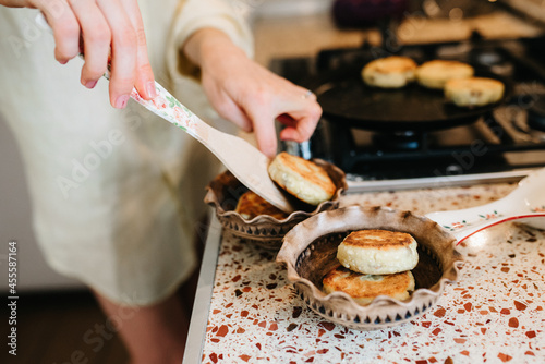 Woman baking bread on a pan