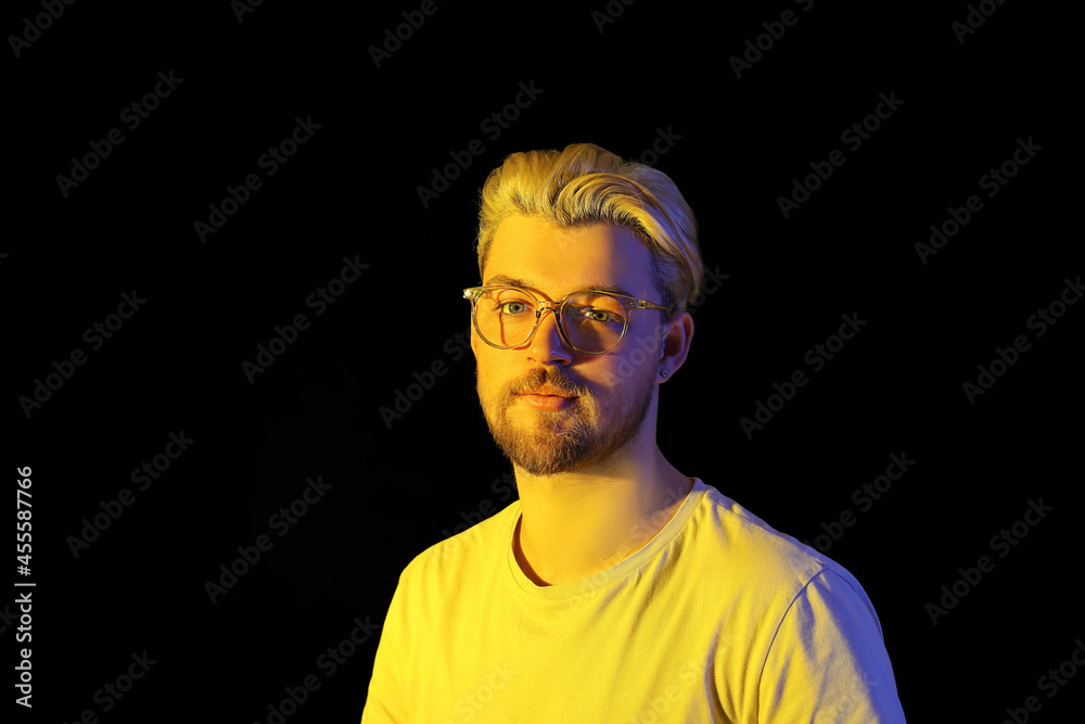 Portrait of handsome young man on dark background Portrait of handsome young man on dark background