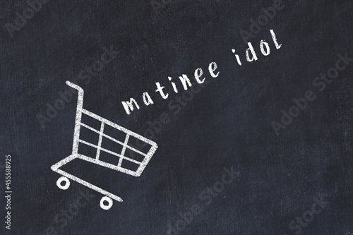 Fotografie Chalk drawing of shopping cart and word matinee idol on black chalboard