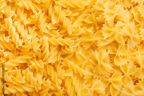 Heap of uncooked pasta as background