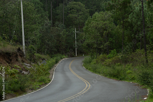 Highway from the mountains of Sinaloa towards the western Sierra Madre, young people on motorcycles.