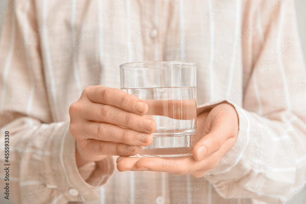 Woman with glass of water, closeup Woman with glass of water, closeup