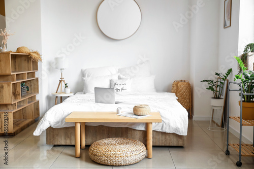 Interior of stylish room with comfortable bed © Pixel-Shot
