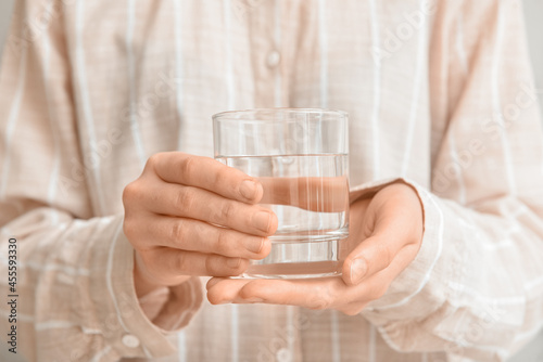 Woman with glass of water, closeup