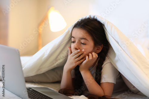 Tired girl watching cartoon...