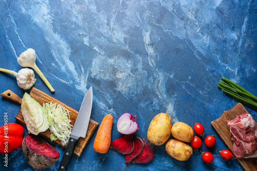 Ingredients for preparing tasty borscht on color background