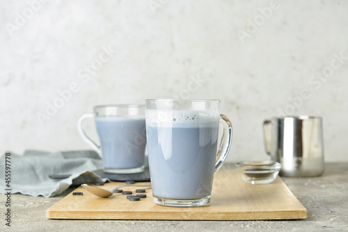 Glass cups of tasty Charcoal Latte on table