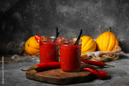 Glasses of tasty bloody Mary cocktail decorated for Halloween on dark background © Pixel-Shot