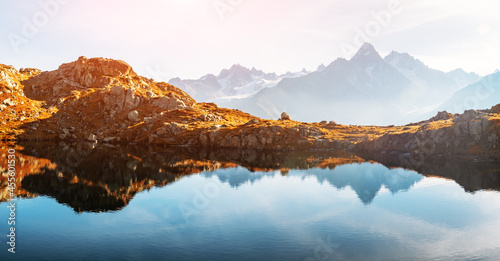 Fototapeta Naklejka Na Ścianę i Meble -  Picturesque panorama of Chesery lake (Lac De Cheserys) and snowy Monte Bianco mountains range on background, Chamonix, France Alps. Landscape photography