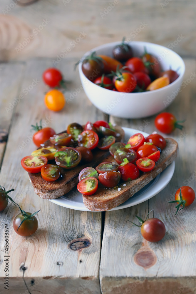 Delicious bruschetta with mini tomatoes and sea salt. Delicious bruschetta with mini tomatoes and sea salt.
