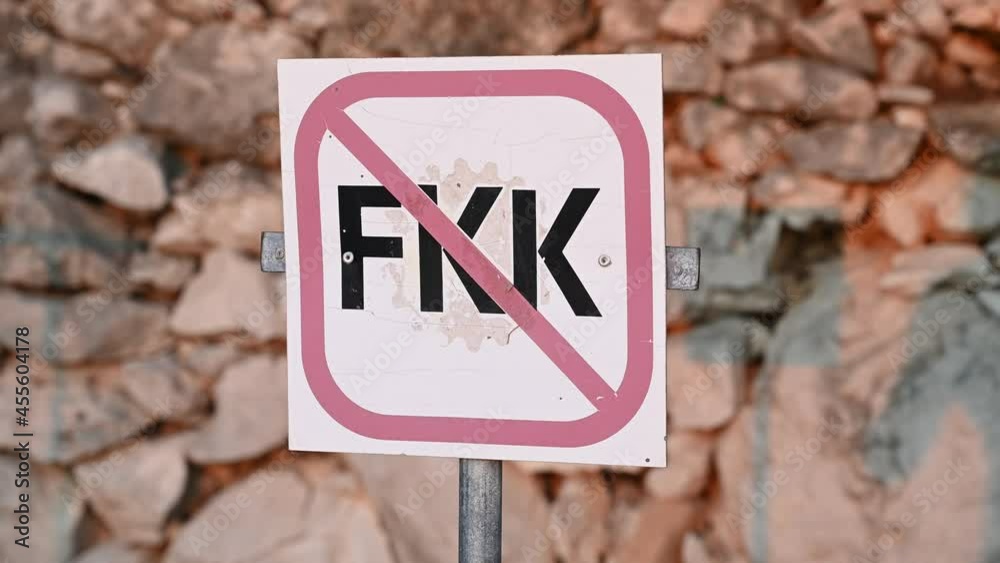 No nudist sign on the beach near sea. NO FKK. Naturism warning sign. No nudist sign on the beach near sea. NO FKK. Naturism warning sign.