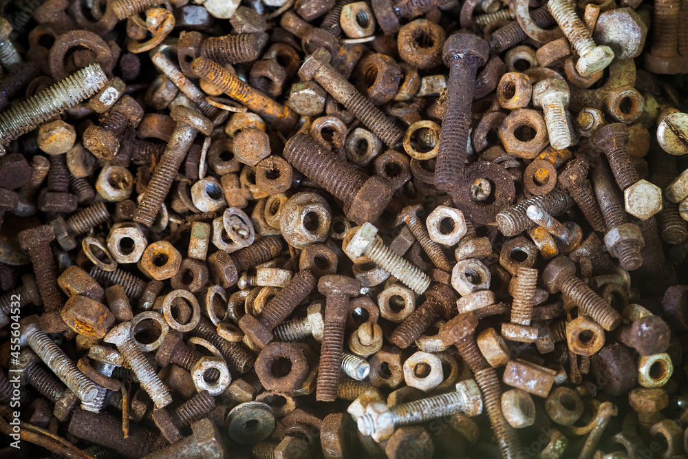 Rusty nuts and screws background. Old rusted abstract metal texture Rusty nuts and screws background. Old rusted abstract metal texture
