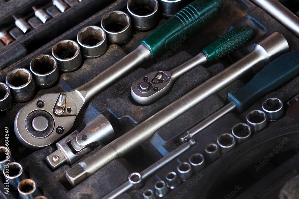 Socket wrench toolbox background. Set of tools for car repair in box, top view Socket wrench toolbox background. Set of tools for car repair in box, top view