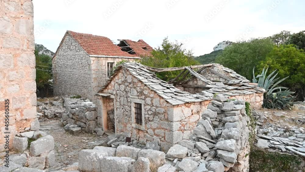 Abandoned and ruined houses in village. Old stone houses and buildings Abandoned and ruined houses in village. Old stone houses and buildings