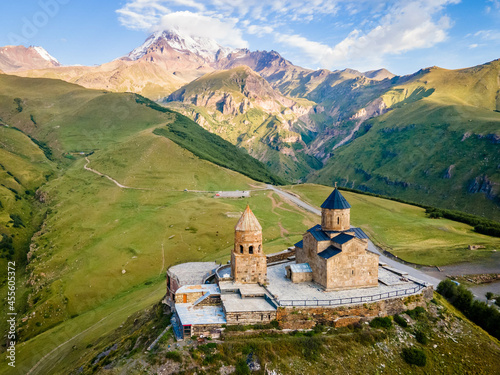 Aerial close up view of Kazbek mountain and Gergeti Trinity Church in Georgia...