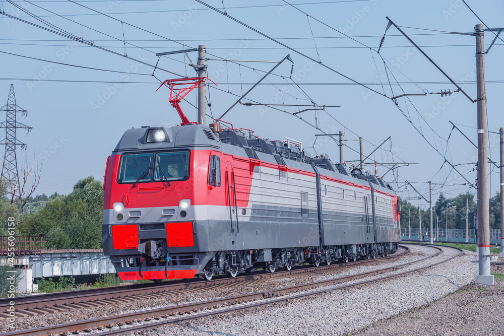 Freight modern electric locomotive approches.