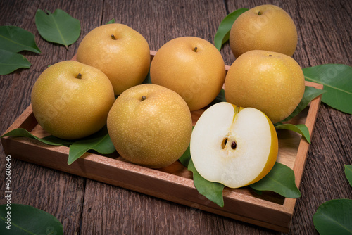 Snow pear or Shingo pear on a wooden background, Korean pear fruits delicious and sweet on wooden background.