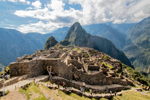panorama view of Machu Picchu and unknown people, Peru